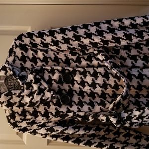 Last Kiss Brand. It's a black/ white coat.